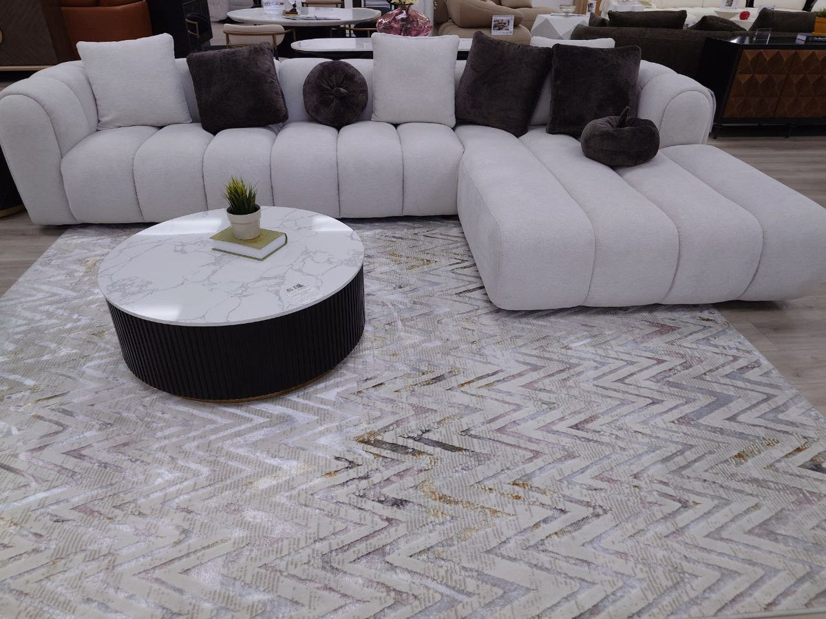 Channel tufted Right facing sectional upholstered in white fabric waccent pillows