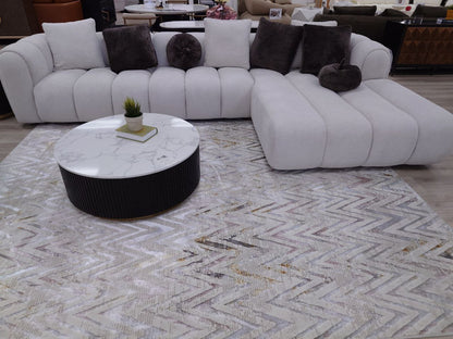 Channel tufted Right facing sectional upholstered in white fabric waccent pillows